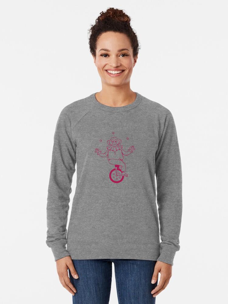 A Mischievous Monkey Juggler Balancing On A Single Wheel Bicycle Sweatshirt - Image 3