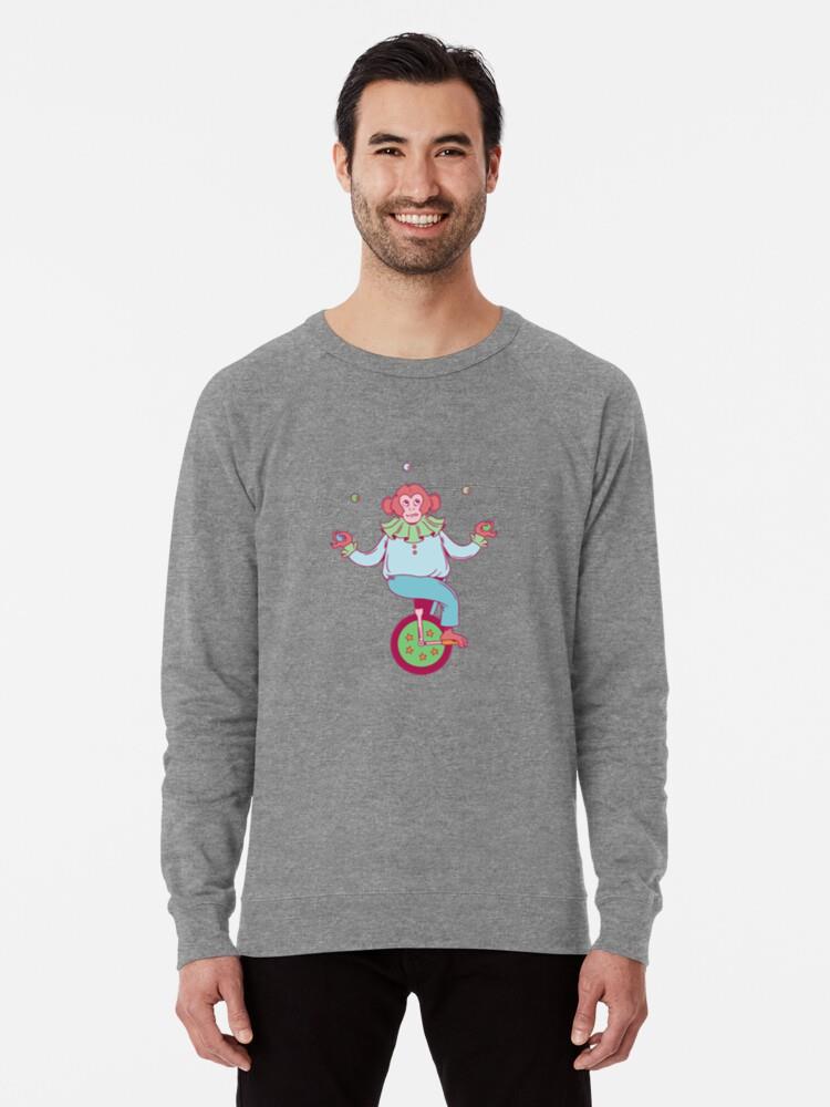 A Mischievous Monkey Juggler Riding A Unicycle Sweatshirt - Image 2